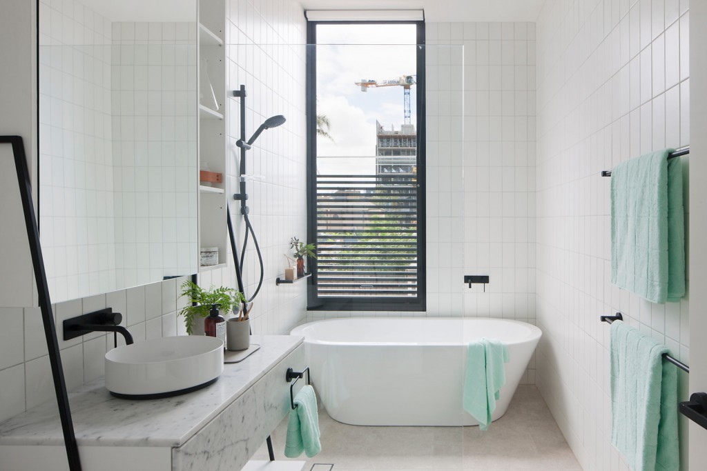What do architects love? Architecture. So how cool would it be to enjoy this gorgeous bathroom and watch some architecture get built outside your window? #ThisOldHouse inspiration via www.L-2-Design.com