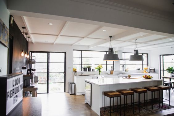 The light in this kitchen is just fantastic. The coffered ceiling gives it volume, the marble kitchen counter bounces the light deeper into the space, and all of those windows...swoon. #ThisOldHouse kitchen inspiration via www.L-2-Design.com