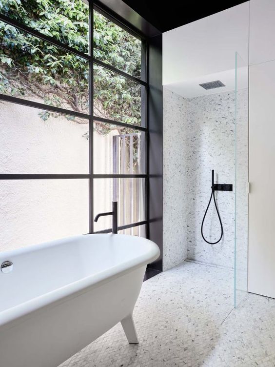 Another bathroom shot from Northbourne, featured previously, showing a bathroom layout with shower and tub spaces working together. The chicken-wire-pattern tile is busy but seems to work well with the natural light.