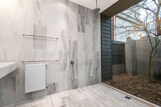 This fully open bathroom space has shower details that fade into the larger whole. The connection to nature is soothing - but I can only surmise it's located in a region with mild climates. #ThisOldHouse shower inspiration via www.L-2-Design.com