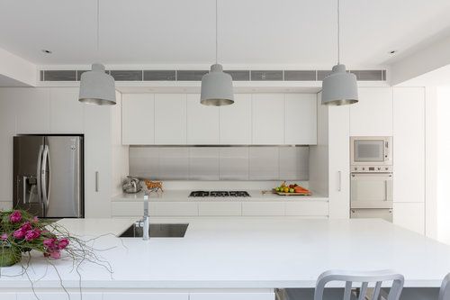 Back to minimal and white. The built-in cabinets encompass an integrated range hood, creating a sense of push/pull geometries that the eye perceives as planes and shapes and then moves on. #ThisOldHouse inspiration via www.L-2-Design.com