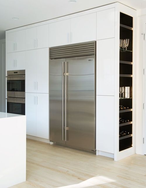 These built-in cabinets on this minimal kitchen geometry show some side flair of dark, yet accessible storage space. Of course it's wine that's stored there, because you might as well make your favorite part of cooking easily accessible. #ThisOldHouse inspiration via www.L-2-Design.com
