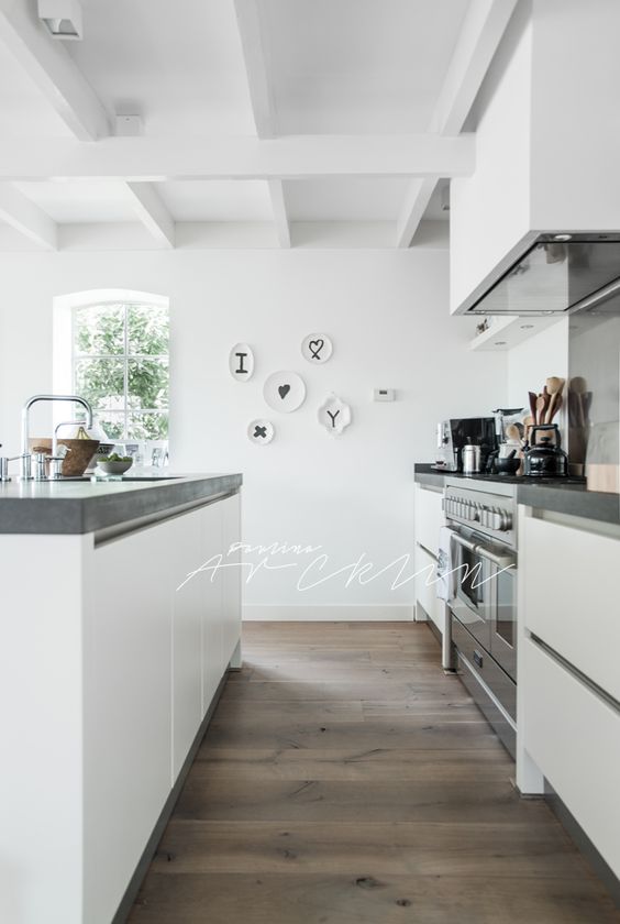 Another gorgeous white kitchen with a concrete countertop....all pretty, dressed in white from head to toe. The simplicity of it is so clean and calm that I can only imagine how wonderful it is to make breakfast in this space...even for this night owl. #ThisOldHouse inspiration via www.L-2-Design.com